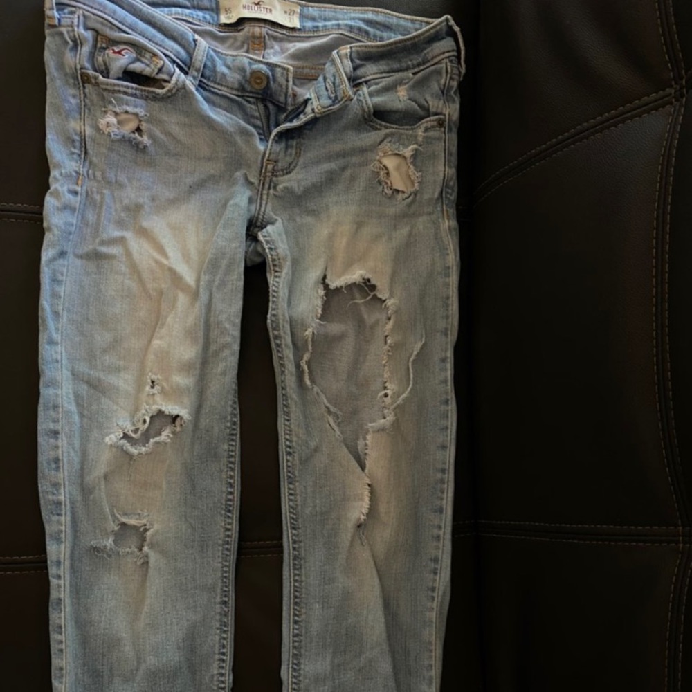 cute low rise light blue ripped jeans:)